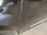 a close up of a car ' s door handle and the door handle is missing