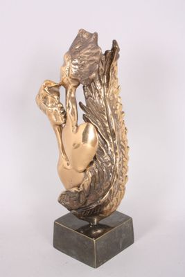 statue of a woman holding a vase in her hands on a marble base