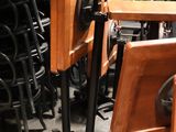 many chairs and a table in a room with a lot of them