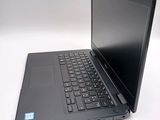 a laptop that is sitting on a white table
