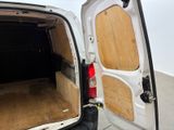 a white van with a wooden door open in a room