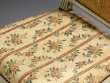 an image of a chair with a floral upholstered seat and back