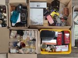 boxes filled with assorted items sitting on top of a wooden floor