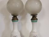 two lamps that are sitting on a wooden table