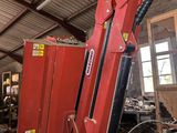 a large red machine that is sitting in a building