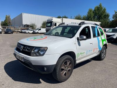 the white truck is parked in a parking lot with other cars