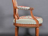 a pair of antique chairs with upholstered upholstered arms