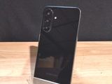 a cell phone that is sitting on a wooden table