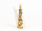 a white vase with a picture of a bird on it