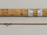two different types of fishing rods and a fishing rod on a white surface