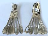 a lot of silver spoons and spoon spoons on the table