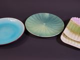 three plates that are sitting next to each other on a table