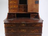 an old wooden dresser with drawers and a mirror on top of it