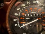 a close up of a speedometer on a motorcycle