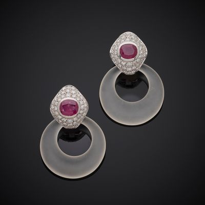 a pair of ruby and diamond earrings