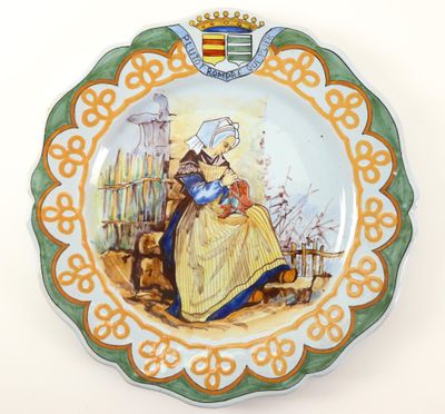 a plate with a picture of a woman and a cat on it