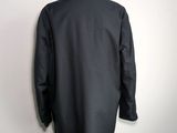 the back view of a black suit on a mannequin dummy
