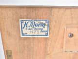 a wooden box with a sign on it that says k - mont