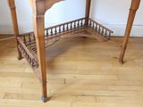 a wooden table with a glass top on a hard wood floor