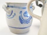 two cups that are sitting next to each other