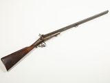 an old gun with a wooden handle on a white background