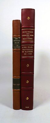two books sitting next to each other on a white surface
