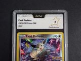 a close up of a pokemon card on a black surface