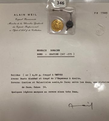 un morceau de papier sur lequel figure une pièce d'or