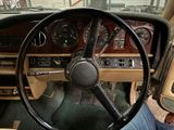 dashboard of a car with a steering wheel and dashboard controls