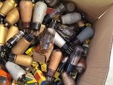 a cardboard box filled with various types of nail polishes