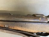 an old gun that is sitting on top of a table