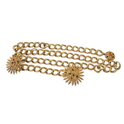 a close up of a gold chain bracelet with sun charms