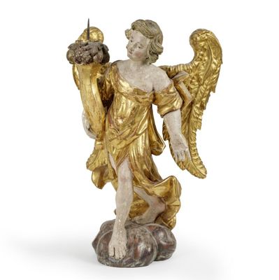 une image représentant une statue d'un ange tenant un oiseau sur un rocher
