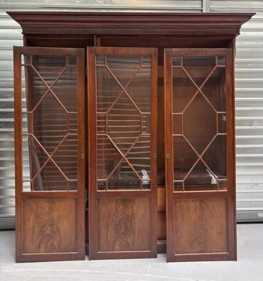 pair of antique mahogany bookcases with leaded glass doors