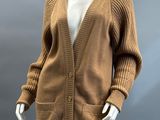 an image of a mannequin mannequin wearing a brown cardigan sweater