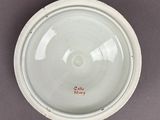 a white plate with a red inscription on it