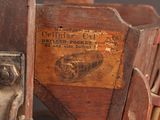 a wooden chair that has a label on it