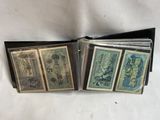 four different bills are sitting in a wallet on a white surface