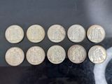 a close up of a bunch of coins sitting on top of a table