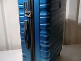 a blue suitcase that is sitting on a table
