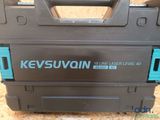 a close up of a tool box on a wooden surface