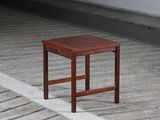 a small wooden table sitting on a wooden floor