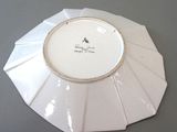 a white plate with a black and white design on it
