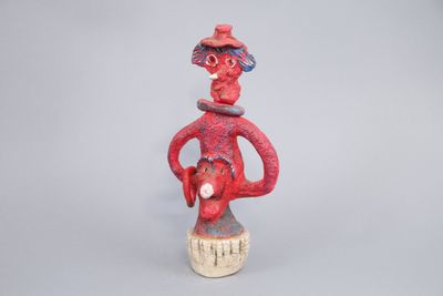 an image of a figurine of a man with a hat on his head
