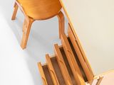 a wooden desk with a chair and a drawer underneath it