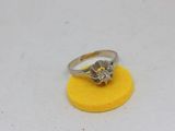 an image of a diamond ring on a yellow sponge
