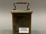 a small clock that is sitting on a table