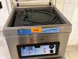 a machine that is sitting on a stand in a kitchen