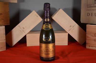 a bottle of wine that is sitting on a table