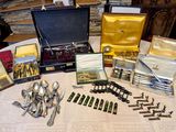 a table with a lot of silverware on it